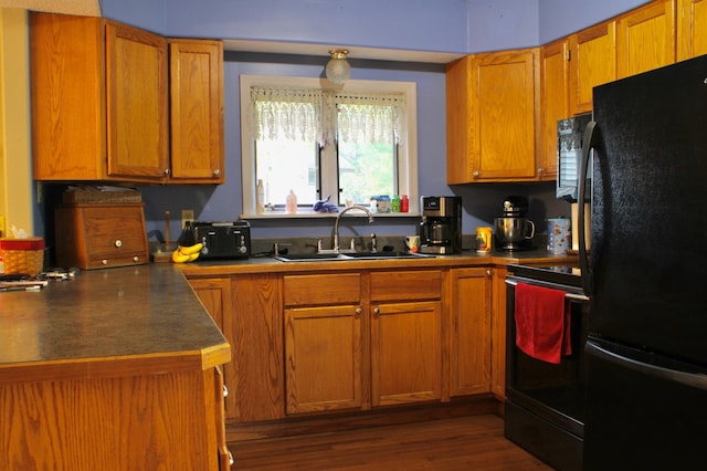 7047 Kingfisher Ln NE, Frohn Twp, MN 56601 - kitchen with freestanding refrigerator, range with electric stovetop, a sink, brown cabinets, and dark wood-type flooring