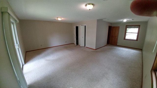 7047 Kingfisher Ln NE, Frohn Twp, MN 56601 - empty room with baseboards and light colored carpet