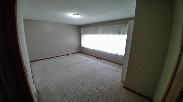 7047 Kingfisher Ln NE, Frohn Twp, MN 56601 - unfurnished room featuring carpet flooring and baseboards