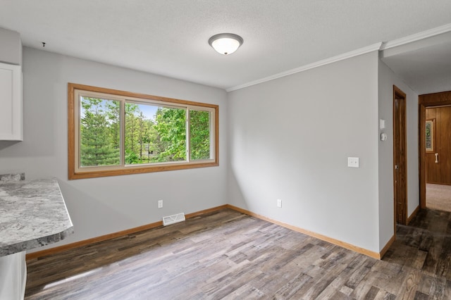 15429 Ramsey Blvd NW, Ramsey, MN 55303 - unfurnished dining area with wood finished floors, baseboards, and ornamental molding