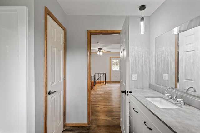 15429 Ramsey Blvd NW, Ramsey, MN 55303 - bathroom featuring wood finished floors, vanity, a ceiling fan, and baseboards