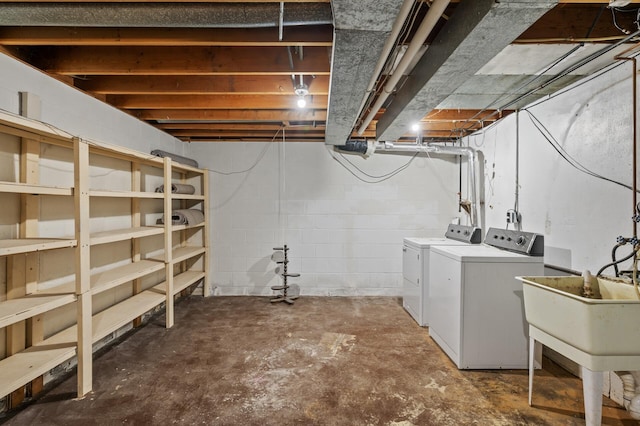 15429 Ramsey Blvd NW, Ramsey, MN 55303 - unfinished below grade area featuring washing machine and clothes dryer and a sink