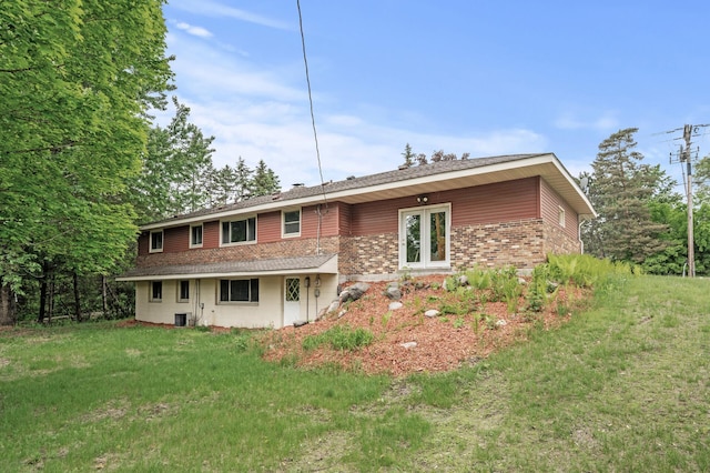 15429 Ramsey Blvd NW, Ramsey, MN 55303 - rear view of house featuring brick siding, a lawn, and central AC unit