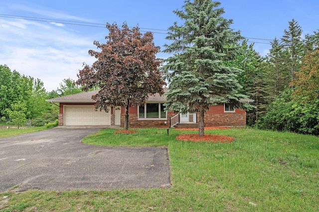 15429 Ramsey Blvd NW, Ramsey, MN 55303 - obstructed view of property with driveway, an attached garage, brick siding, and a front yard