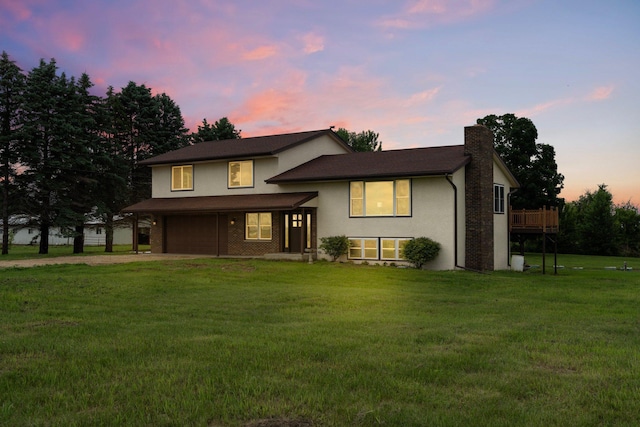 17323 County 31st Blvd, Welch Twp, MN 55089 - view of front facade with a chimney, driveway, an attached garage, a front lawn, and stucco siding
