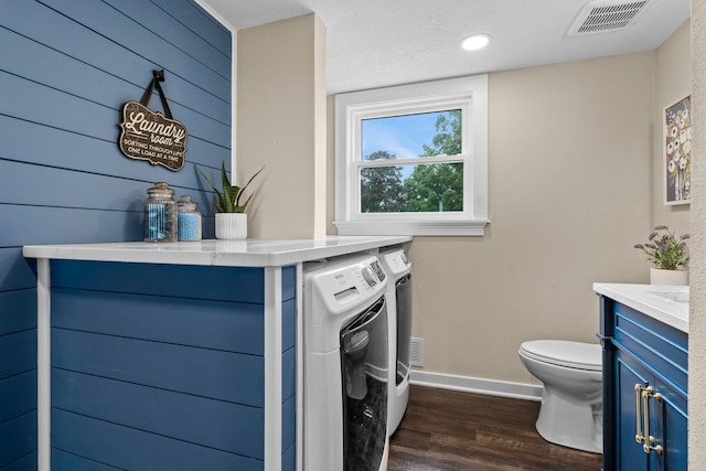 17323 County 31st Blvd, Welch Twp, MN 55089 - bathroom with washer and clothes dryer, vanity, and wood finished floors