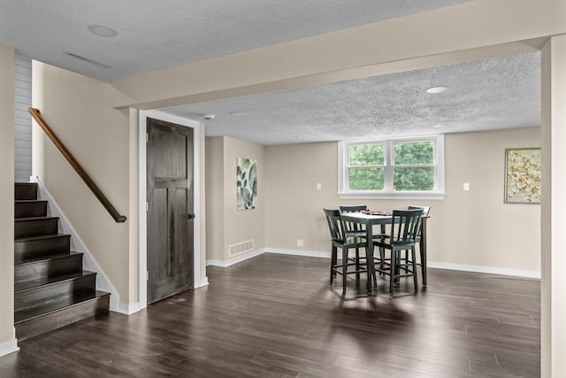17323 County 31st Blvd, Welch Twp, MN 55089 - dining room featuring a textured ceiling, stairs, and dark wood-style floors