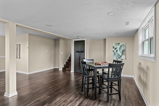 17323 County 31st Blvd, Welch Twp, MN 55089 - dining room with dark wood-type flooring, stairway, and a textured ceiling