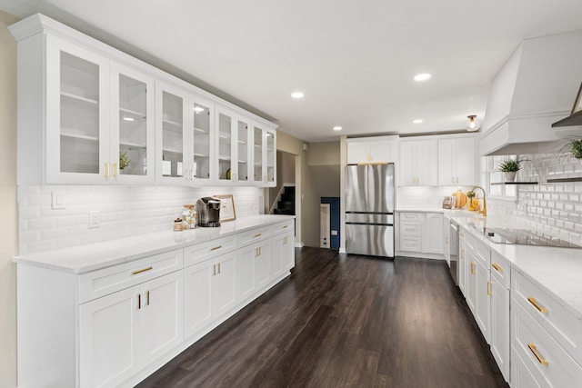 17323 County 31st Blvd, Welch Twp, MN 55089 - kitchen featuring freestanding refrigerator, black electric stovetop, backsplash, white cabinets, and dark wood-style floors