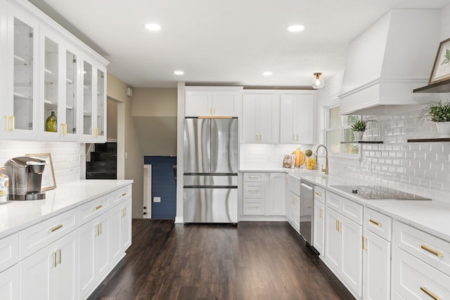 17323 County 31st Blvd, Welch Twp, MN 55089 - kitchen with stainless steel appliances, backsplash, white cabinets, glass insert cabinets, and recessed lighting