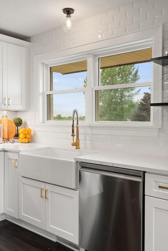 17323 County 31st Blvd, Welch Twp, MN 55089 - kitchen featuring stainless steel dishwasher, white cabinets, light countertops, and decorative backsplash