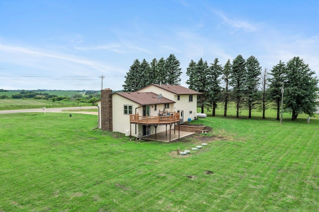 17323 County 31st Blvd, Welch Twp, MN 55089 - rear view of house with a wooden deck, a lawn, stucco siding, and a chimney