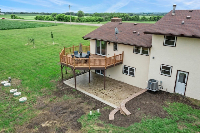 17323 County 31st Blvd, Welch Twp, MN 55089 - back of house with stucco siding, a deck, a yard, a shingled roof, and a chimney