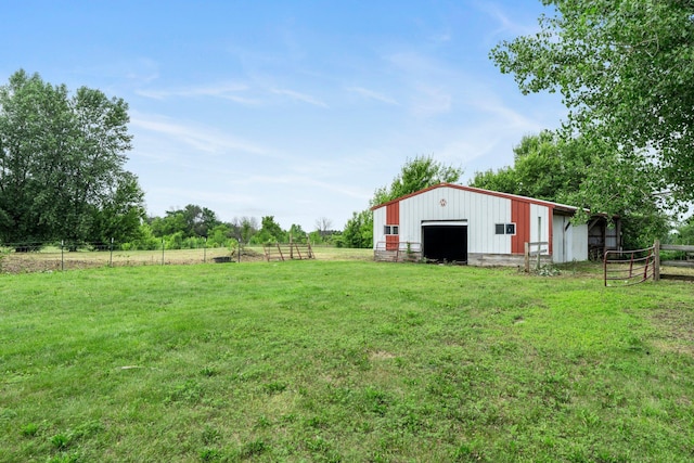 17323 County 31st Blvd, Welch Twp, MN 55089 - view of yard featuring a pole building, a garage, an outdoor structure, and a view of countryside