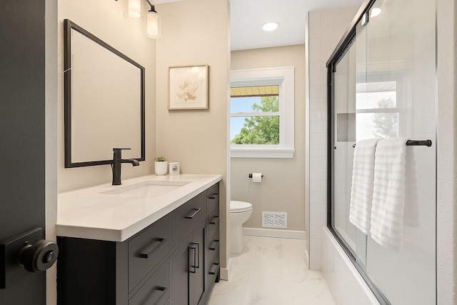 17323 County 31st Blvd, Welch Twp, MN 55089 - bathroom with vanity, marble look tile flooring, and shower / bath combination with glass door
