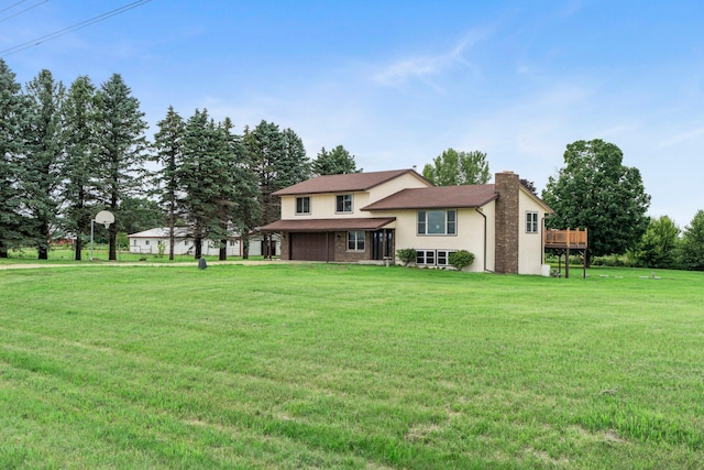 17323 County 31st Blvd, Welch Twp, MN 55089 - split level home with a chimney, an attached garage, a front yard, and stucco siding