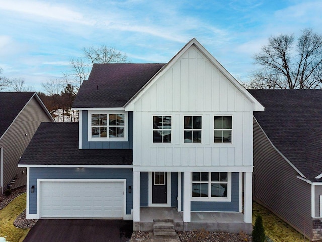 7830 Adler Trl, Inver Grove Heights, MN 55077 - modern inspired farmhouse with board and batten siding, roof with shingles, driveway, a porch, and a garage