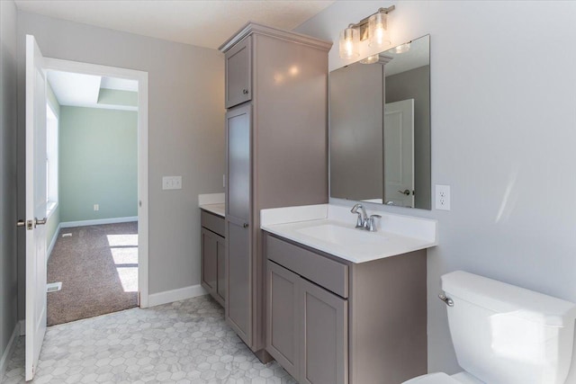 7830 Adler Trl, Inver Grove Heights, MN 55077 - bathroom with vanity, toilet, and baseboards