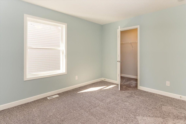 7830 Adler Trl, Inver Grove Heights, MN 55077 - unfurnished bedroom featuring carpet floors, baseboards, a spacious closet, and a closet