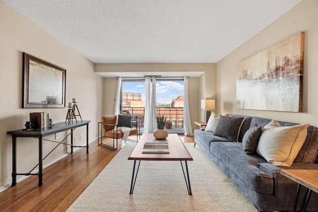 26 10th St W Unit 706, Saint Paul, MN 55102 - living room with wood finished floors, baseboards, and a textured ceiling
