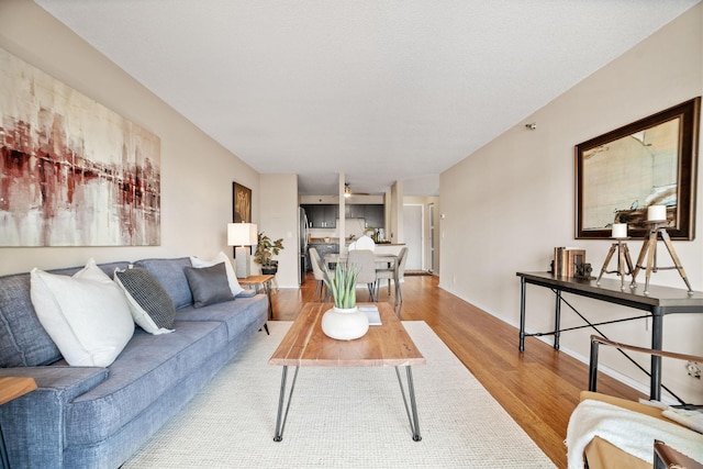 26 10th St W Unit 706, Saint Paul, MN 55102 - living room featuring wood finished floors and baseboards