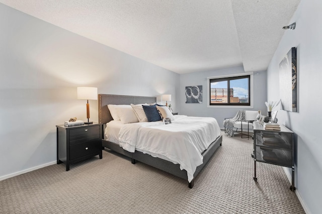 26 10th St W Unit 706, Saint Paul, MN 55102 - bedroom featuring light carpet, baseboards, and a textured ceiling