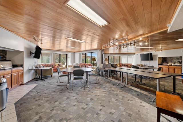 26 10th St W Unit 706, Saint Paul, MN 55102 - dining room featuring wood ceiling, track lighting, and light carpet