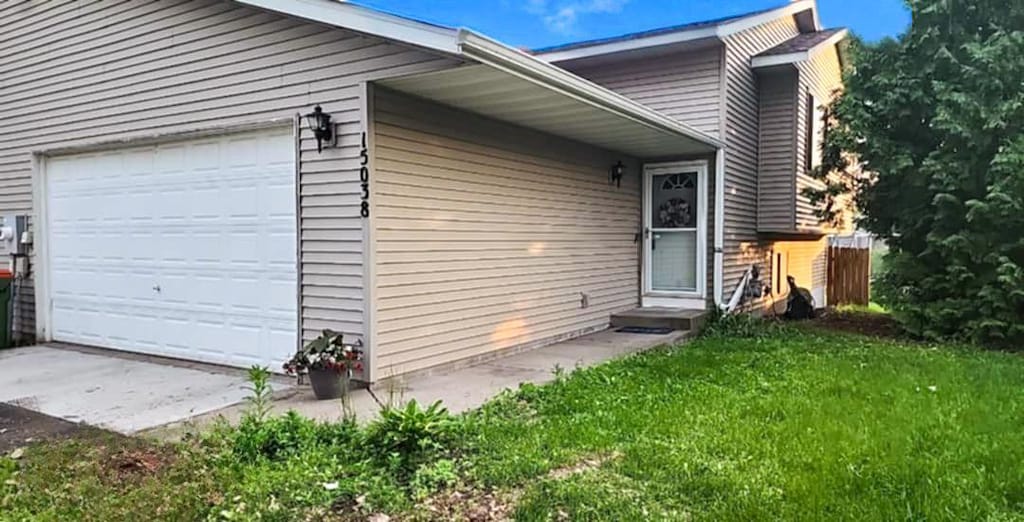 15038 Glenbrook Ave N, Hugo, MN 55038 - view of side of home with a garage and a yard
