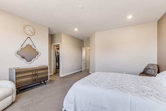 6944 Xanthus Ln N, Maple Grove, MN 55311 - bedroom featuring carpet flooring, baseboards, a walk in closet, recessed lighting, and a textured ceiling