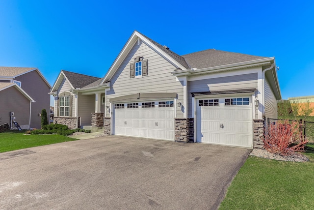 6944 Xanthus Ln N, Maple Grove, MN 55311 - view of front of house with stone siding and driveway