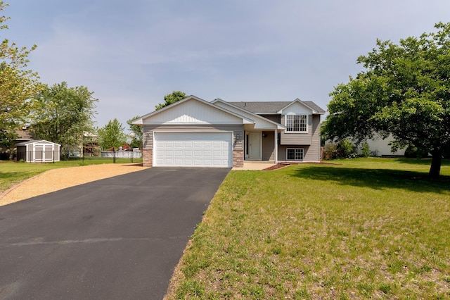 217 Hickory Ln E, Shakopee, MN 55379 - tri-level home with driveway, an attached garage, and brick siding