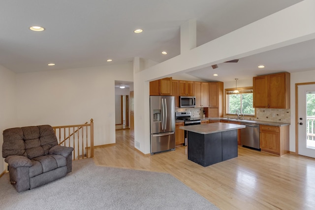 217 Hickory Ln E, Shakopee, MN 55379 - kitchen with stainless steel appliances, open floor plan, a sink, tasteful backsplash, and recessed lighting