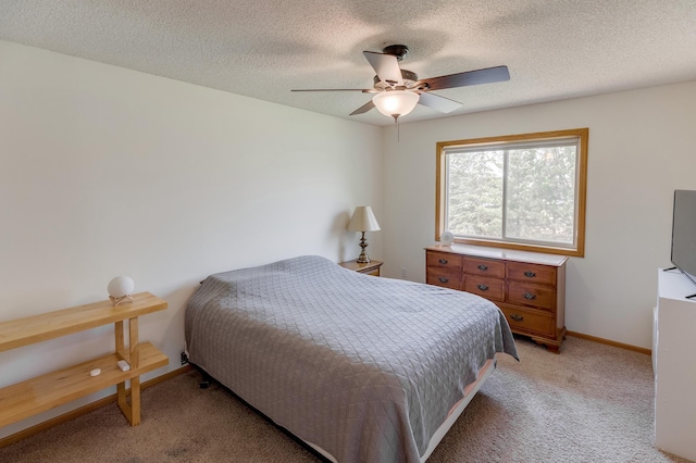 217 Hickory Ln E, Shakopee, MN 55379 - bedroom featuring light carpet, baseboards, a textured ceiling, and ceiling fan
