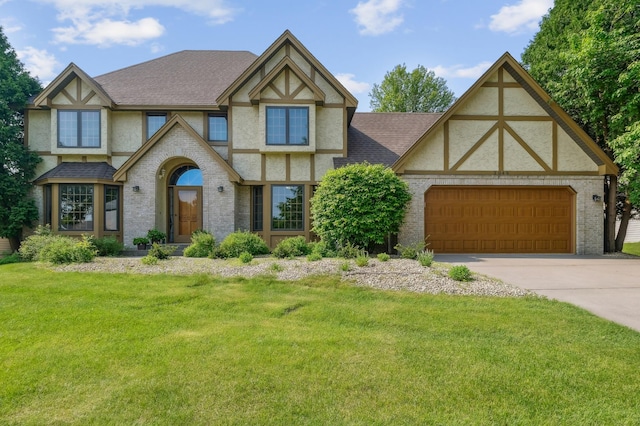3049 12th St NW, New Brighton, MN 55112 - english style home with stucco siding, driveway, and a front lawn