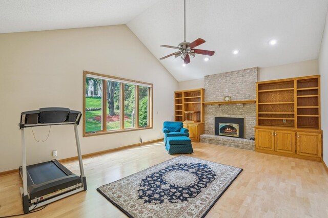 3049 12th St NW, New Brighton, MN 55112 - exercise area with ceiling fan, wood finished floors, high vaulted ceiling, a brick fireplace, and recessed lighting