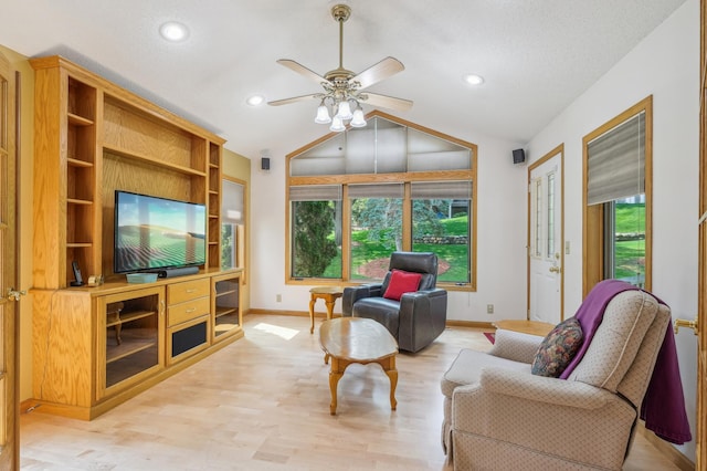 3049 12th St NW, New Brighton, MN 55112 - living room with a ceiling fan, baseboards, vaulted ceiling, recessed lighting, and light wood-style flooring