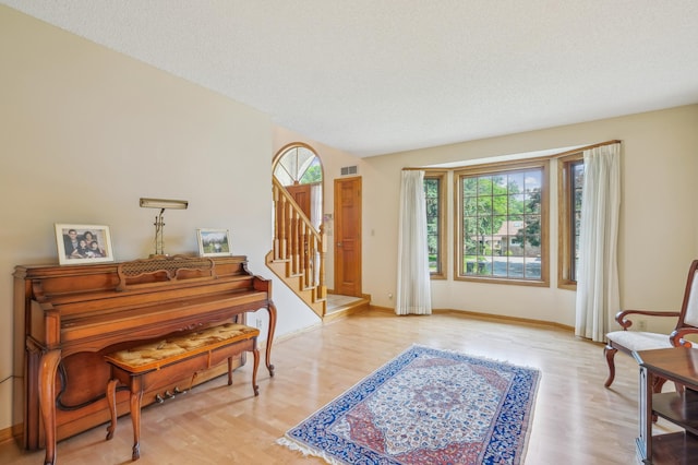 3049 12th St NW, New Brighton, MN 55112 - entrance foyer featuring wood finished floors, stairway, and baseboards