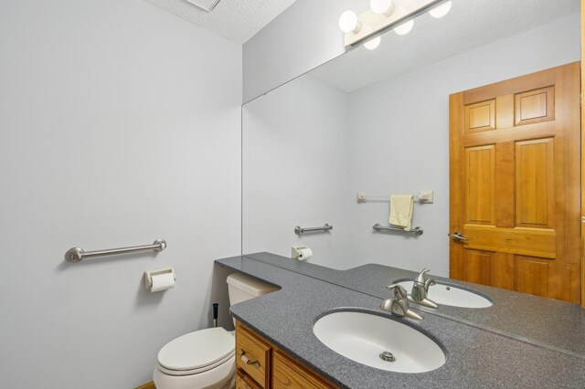 3049 12th St NW, New Brighton, MN 55112 - half bathroom with toilet, vanity, and a textured ceiling
