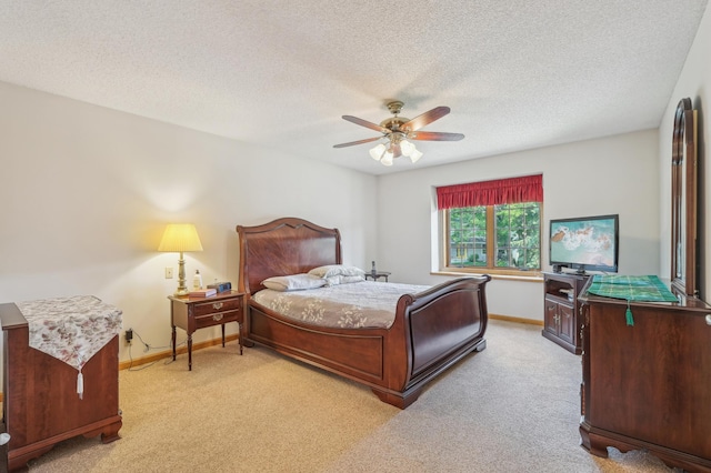 3049 12th St NW, New Brighton, MN 55112 - bedroom with light colored carpet, a textured ceiling, baseboards, and a ceiling fan