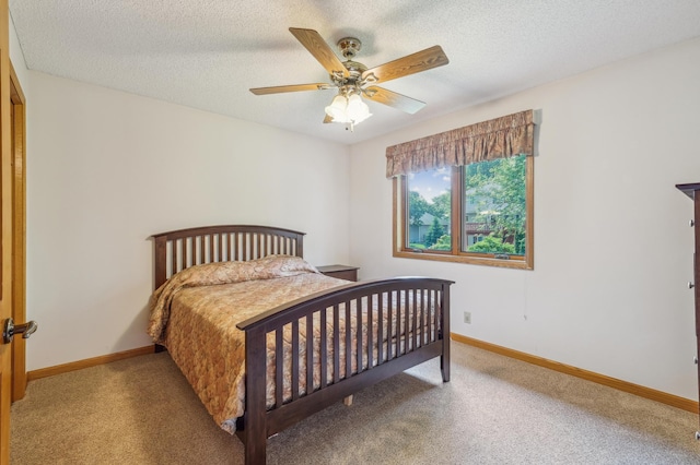 3049 12th St NW, New Brighton, MN 55112 - bedroom featuring carpet, baseboards, a textured ceiling, and a ceiling fan