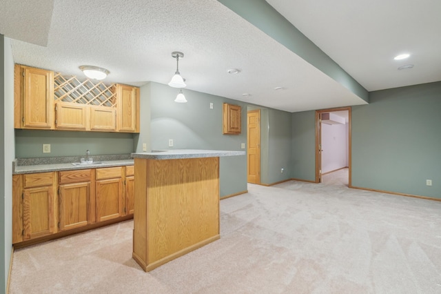 3049 12th St NW, New Brighton, MN 55112 - kitchen with a sink, light colored carpet, a kitchen island, baseboards, and decorative light fixtures