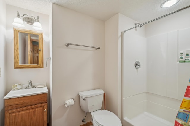 3049 12th St NW, New Brighton, MN 55112 - bathroom with a shower, vanity, toilet, and a textured ceiling