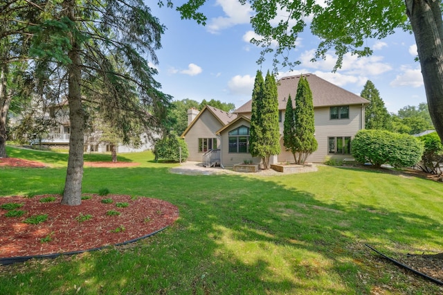 3049 12th St NW, New Brighton, MN 55112 - rear view of property with a lawn