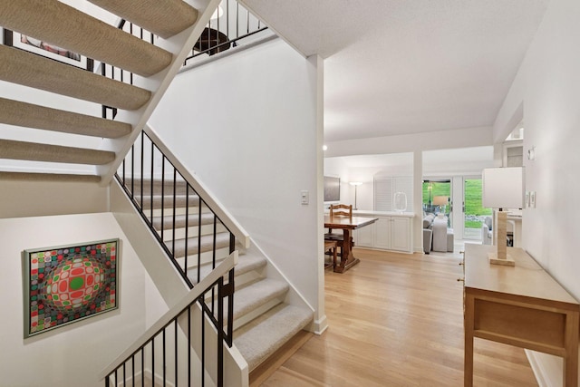 6050 Blake Ridge Rd, Edina, MN 55436 - staircase featuring wood finished floors