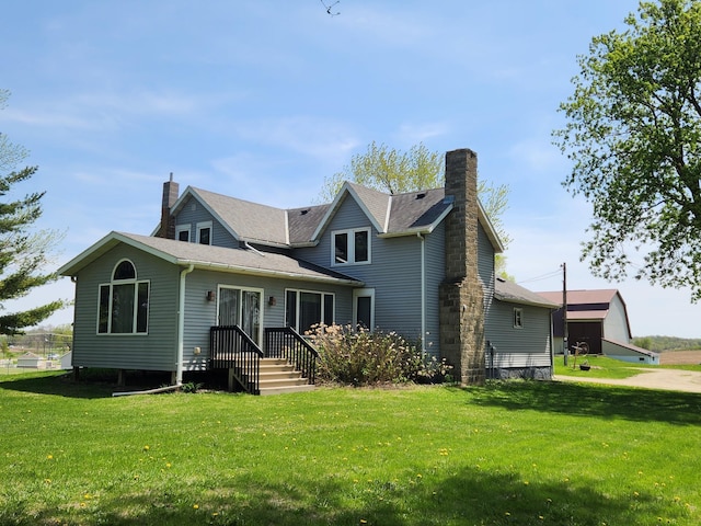 6200 37th St W, Webster, MN 55088 - rear view of house featuring a yard and a chimney