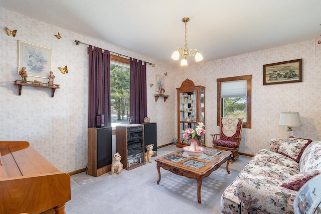 6200 37th St W, Webster, MN 55088 - carpeted living room with wallpapered walls, a chandelier, and baseboards