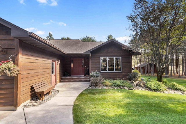 12584 County 18 SW, Brainerd, MN 56401 - property entrance with a yard and a shingled roof