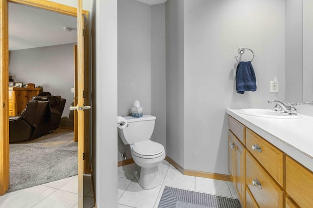 12584 County 18 SW, Brainerd, MN 56401 - bathroom with vanity, toilet, tile patterned flooring, and baseboards