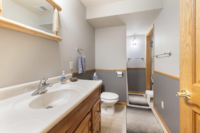 12584 County 18 SW, Brainerd, MN 56401 - bathroom featuring toilet, vanity, and tile patterned floors