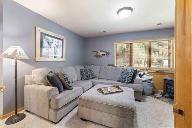 12584 County 18 SW, Brainerd, MN 56401 - living area featuring a wood stove, carpet, and baseboards